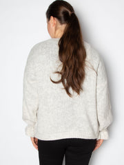 Kort cardigan med flæsekant