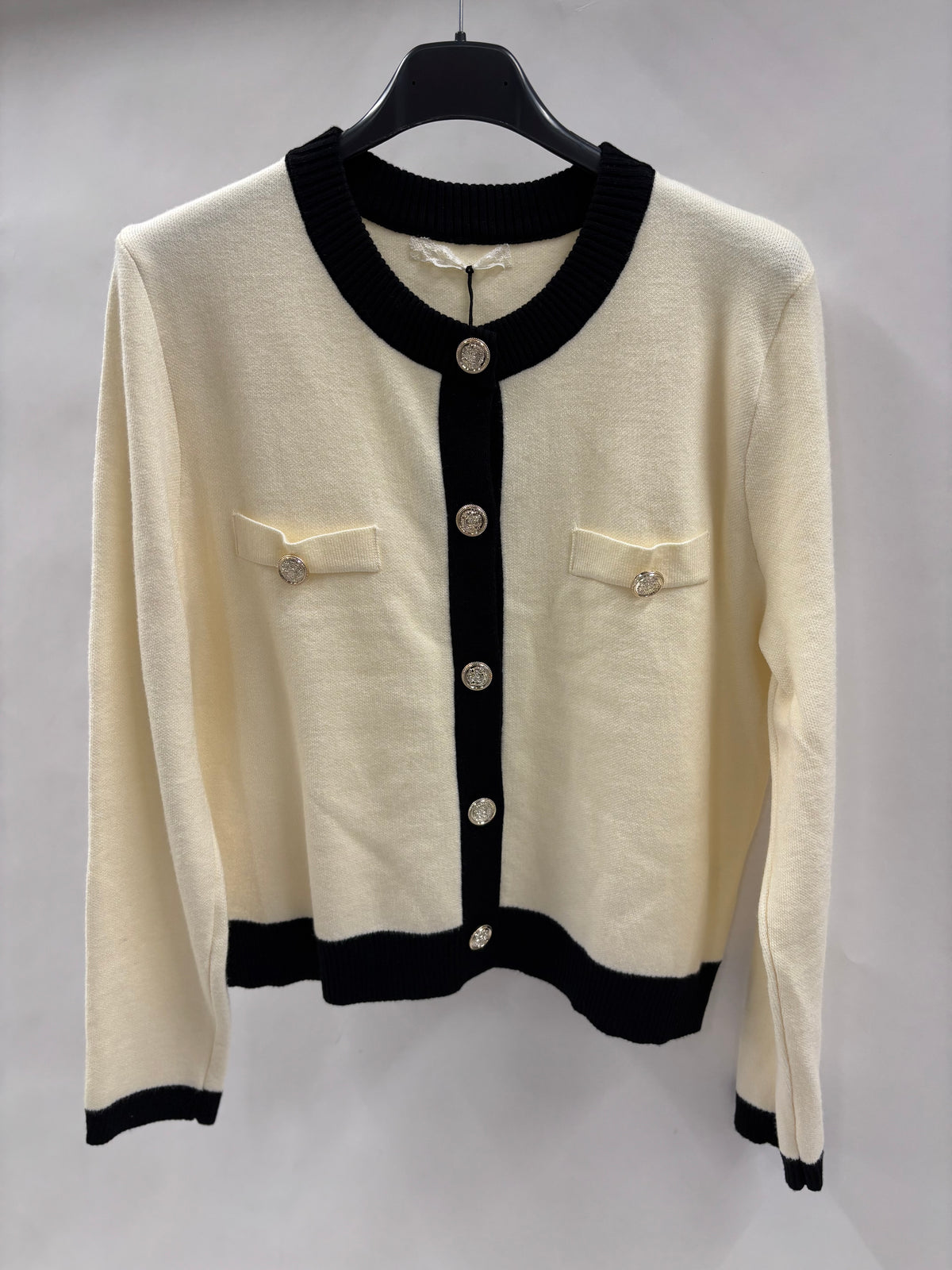 Strikjakke, Guldknapper