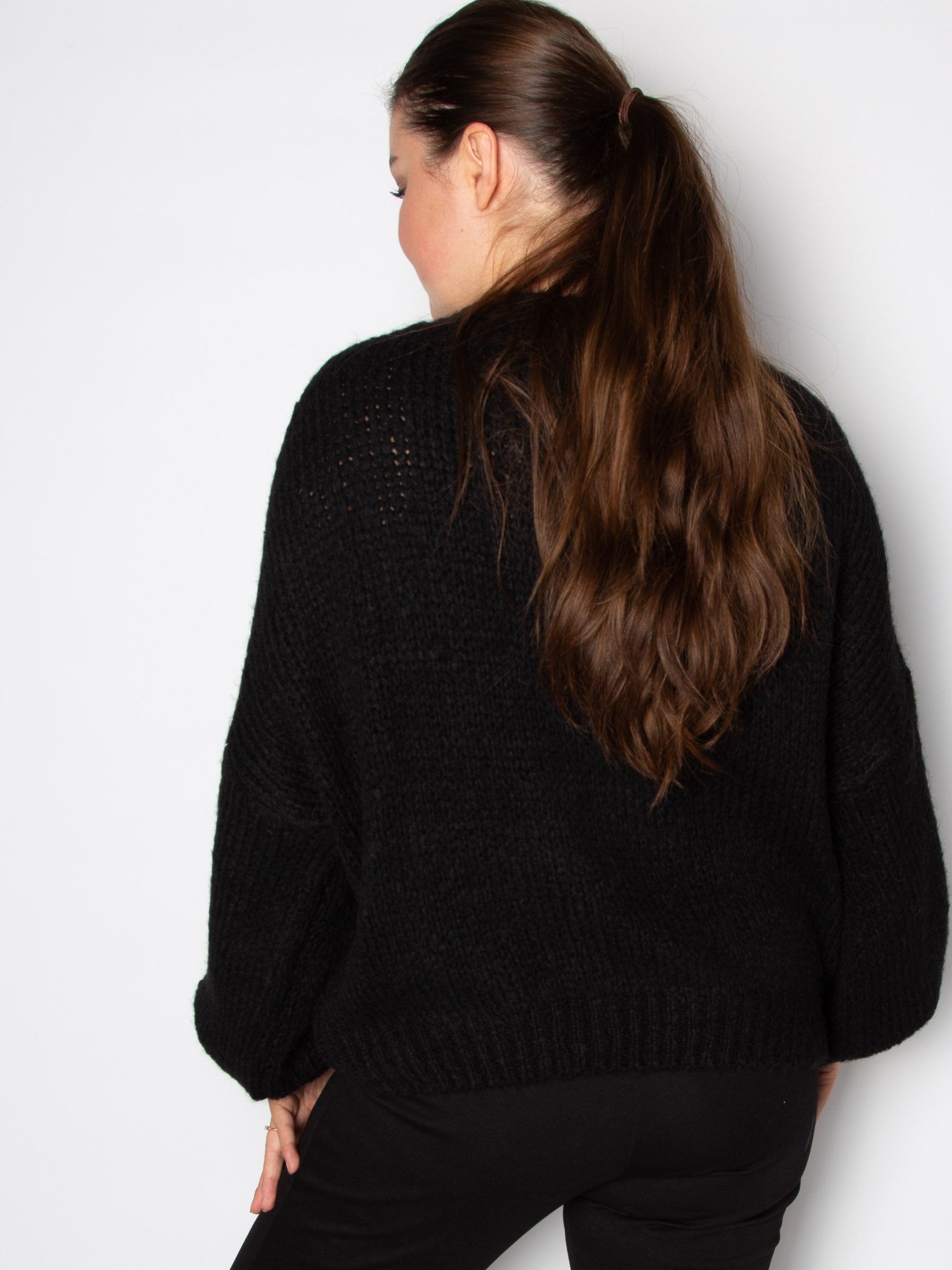 Vamset striktrøje