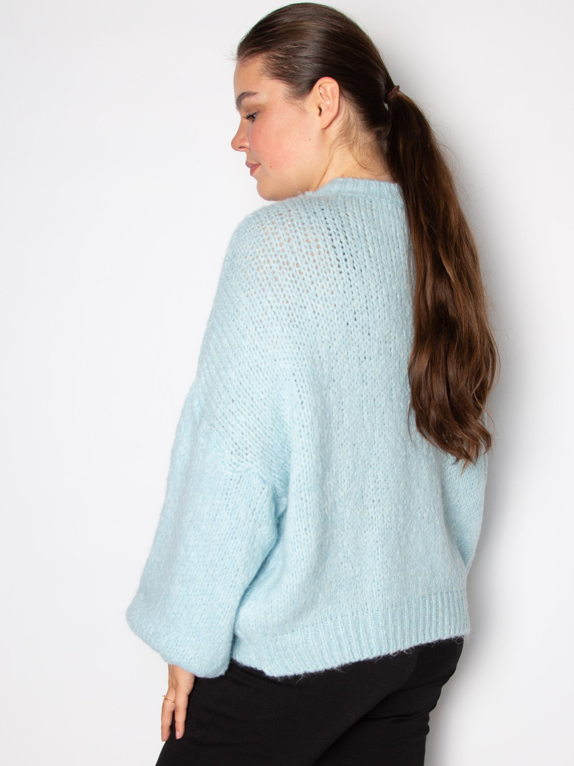 Vamset striktrøje
