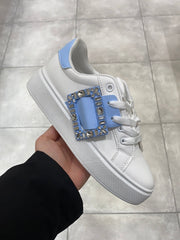 Sneakers with bling brooch